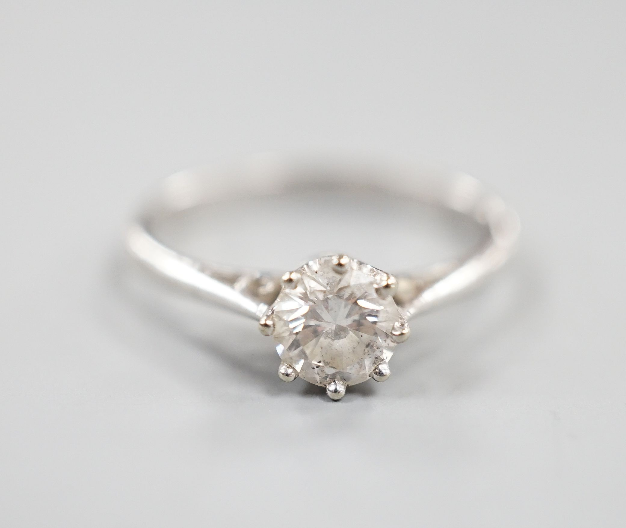 A modern 18ct white gold and solitaire diamond ring, size N, gross weight 2.2 grams, the stone measuring 5.2mm in diameter.